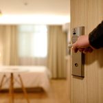 a hotel room seen from a partially open door